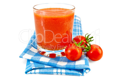 Juice tomato in glass on a napkin