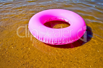 Pink lifebuoy in the water