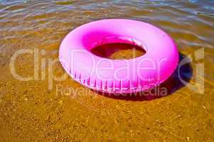 Pink lifebuoy in the water