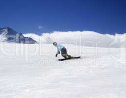 Snowboarding in mountains