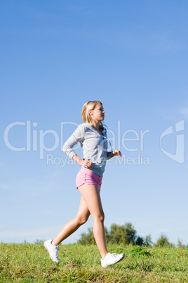 Jogging young sportive woman meadows sunny day