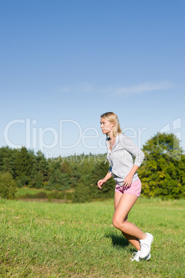 Jogging young sportive woman meadows sunny day
