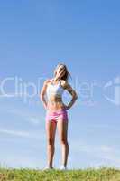 Stretching young sportive woman meadows sunny day