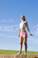 Stretching sport fit woman summer blue sky