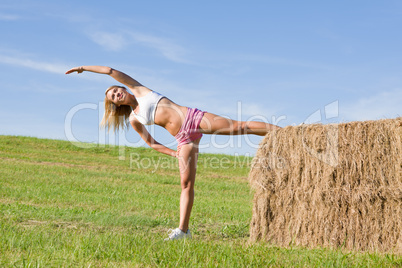 Stretching sport fit woman summer blue sky