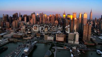 Aerial of the sun reflecting in the buildings of the Financial District, NY, USA