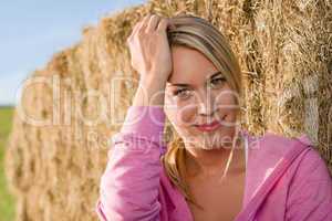 Sportive young woman relax by bales sunset