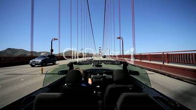 Young Female Driving on Golden Gate Bridge