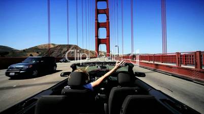 Carefree Female Driving the Golden Gate Bridge