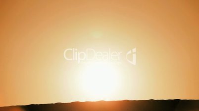 Lone Hiker in Silhouette on Sand Dunes