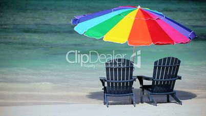 Chairs in Gentle Ocean Waves on Luxury Beach