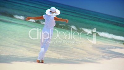 Female Walking on Tropical White Sand Beach