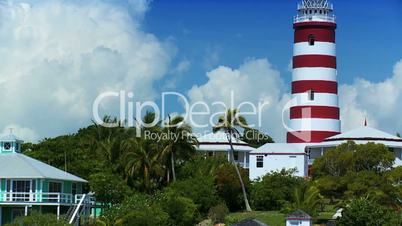 Tropical Island Lighthouse with Passing Yachts
