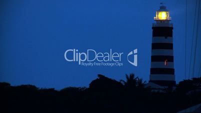 Revolving Light of Island Light House at Dusk