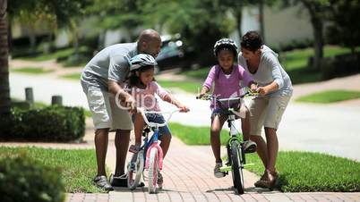 Little African American Girls Learning to Ride a Bike