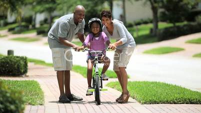 African American Child Practicing on her Bicycle