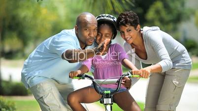 African American Child Practicing on her Bicycle