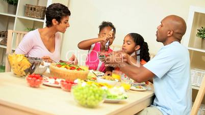 Young Ethnic Family Sharing Healthy Lunch