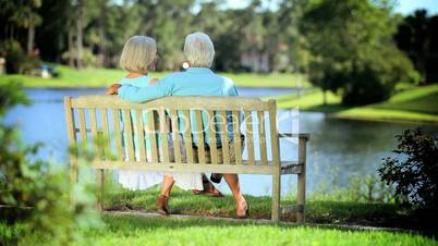 Older Couple on Park Bench Enjoying the View