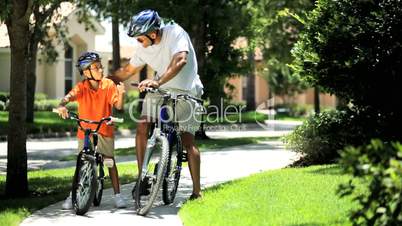 Ethnic Father & Son on Bicycles