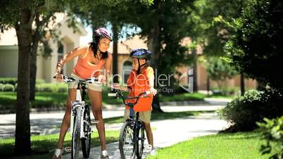 Ethnic Mother & Son on Bicycles