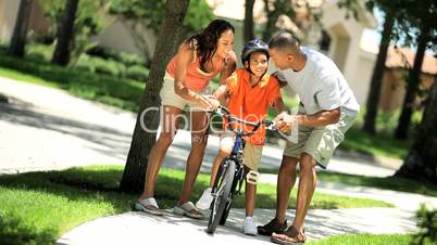 Young Ethnic Boy Learning to Ride a Bicycle