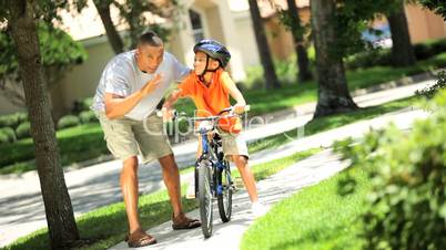 African American Child Practicing on his Bicycle