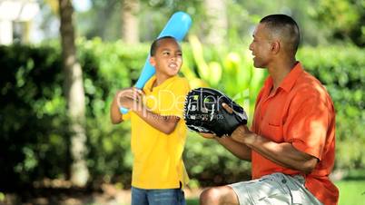 African American Father & Son Practicing Baseball