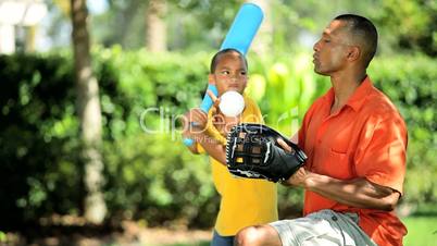 Ethnic Father & Son Practicing Baseball