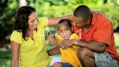 Ethnic Parents Discussing Sport Practice with Young Son