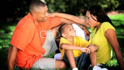 Young Ethnic Family Together Outdoors