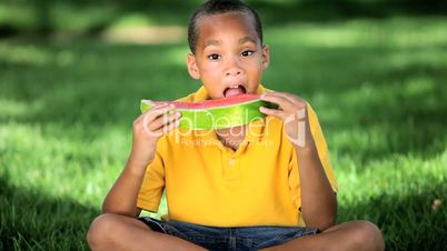 Young Ethnic Boy Enjoying Healthy Water Melon