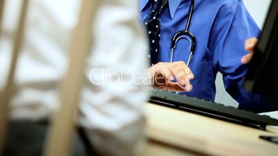 Senior Male Consultant with Patient