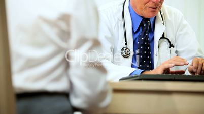 Mature Male Medical Consultant with Patient