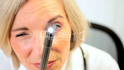 Senior Female Doctor Doing Medical Examination