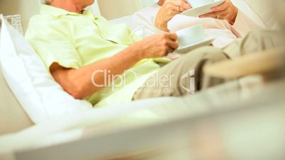 Confident Retired Couple Relaxing at Home