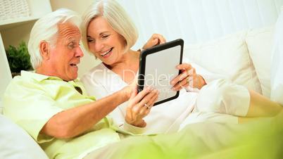 Retired Couple Using Wireless Tablet Technology