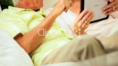 Retired Couple Using Wireless Tablet Technology