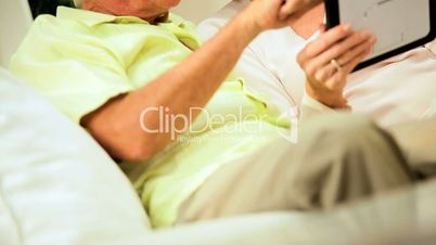 Mature Couple Using a Wireless Tablet