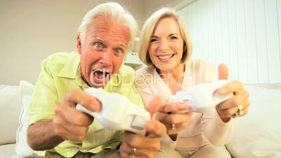 Retired Couple Competing on Games Console