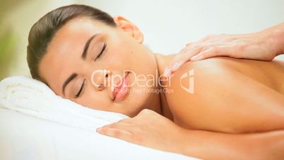 Beautiful Girl Enjoying Massage Treatment
