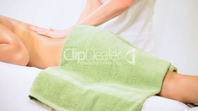 Brunette Client Receiving Body Massage at Spa Club