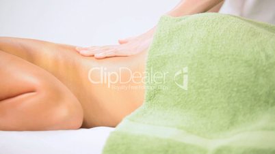 Brunette Client Receiving Body Massage at Spa Club