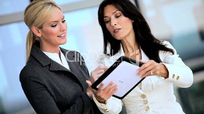 Smart Businesswomen with Wireless Tablet