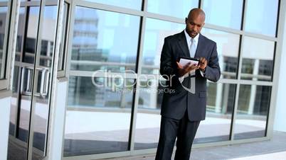 Ambitious Business Executives Using Wireless Tablet Outdoors