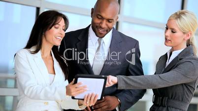 Three Multi Ethnic Business People with Wireless Tablet