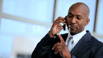 Young African American Businessman with Smartphone