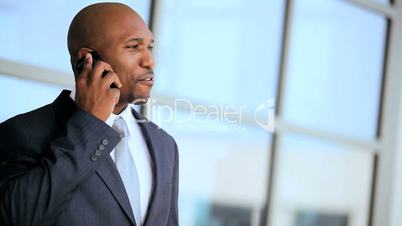 African American Executive Using a Smartphone Outdoors