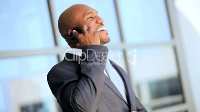 Ethnic Businessman Receiving Good News by Smartphone