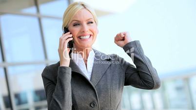 Businesswoman Receiving Good News on Smartphone